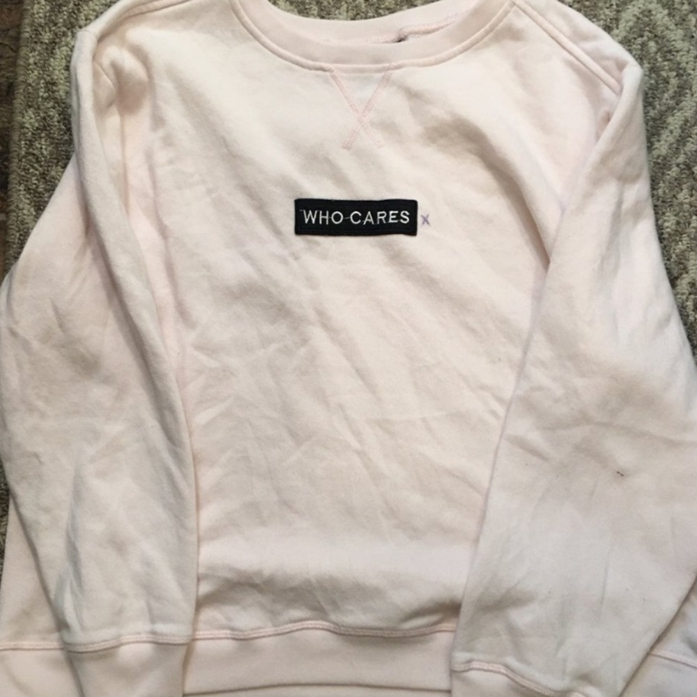 Pink crew neck with who cares patch